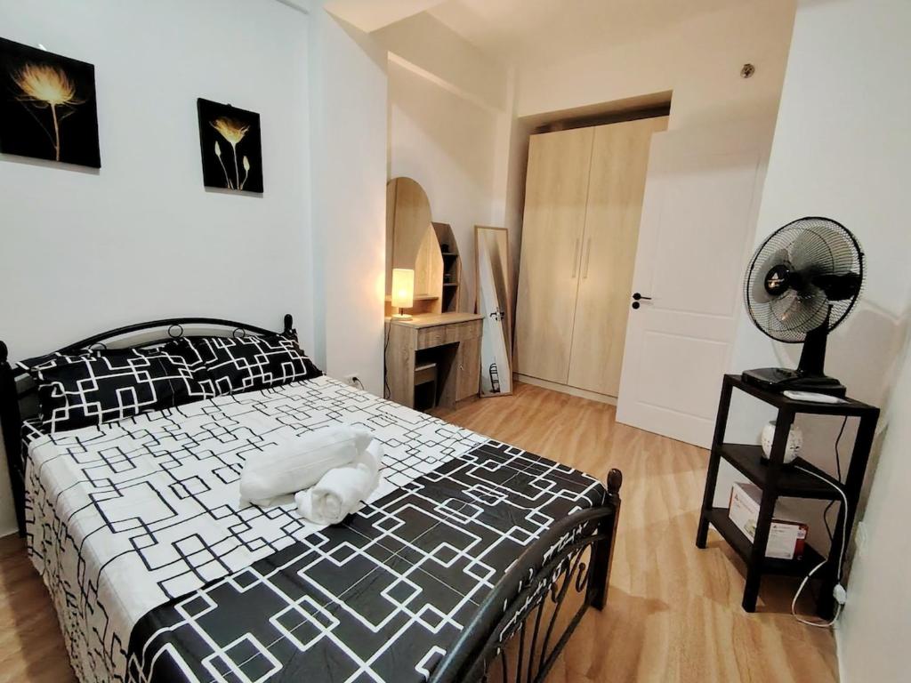 Postel nebo postele na pokoji v ubytování Magoncia Condo Feel at Home and Enjoy Vacation