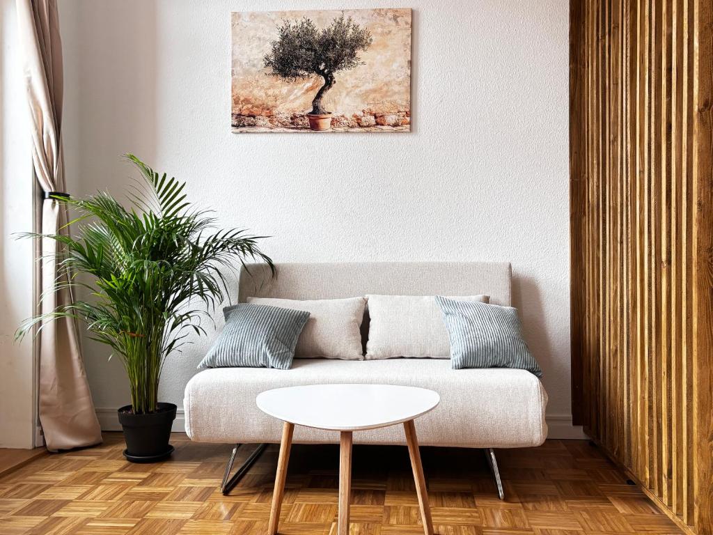 a living room with a couch and a table at Apartment City in Cottbus