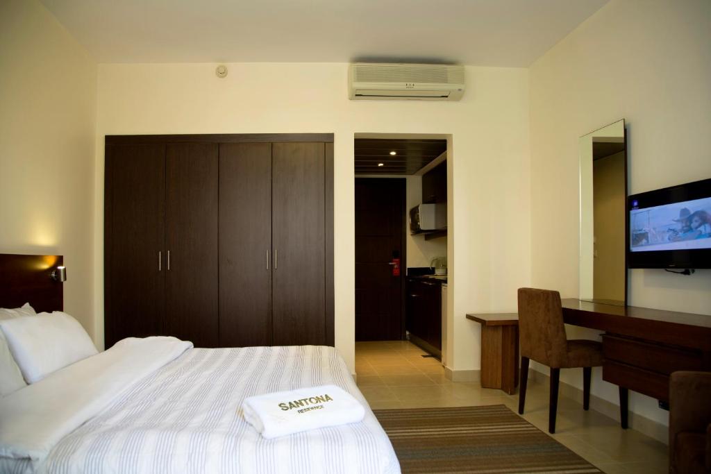 Postel nebo postele na pokoji v ubytování Santona Residence