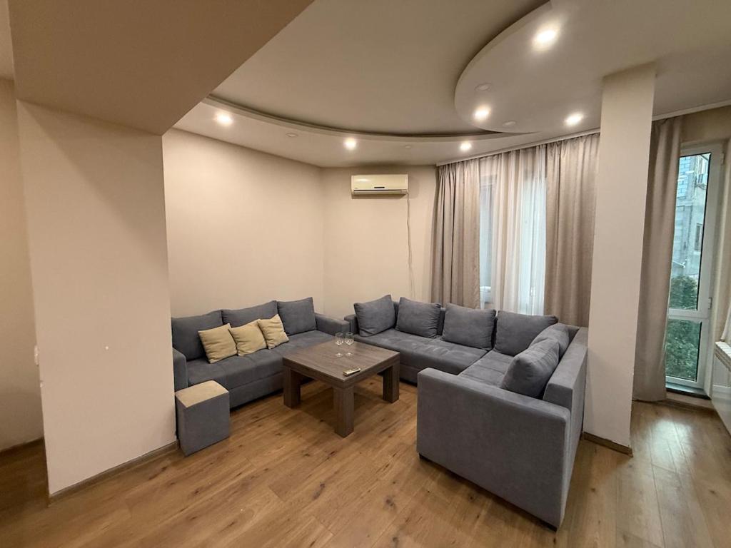 a living room with a couch and a table at Family Comfort Apartment on Mashtots 3 in Aghk'ilisa