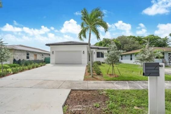 a house with a palm tree in front of a driveway at Modern 3BED 2BATH House in Fort Lauderdale in Fort Lauderdale