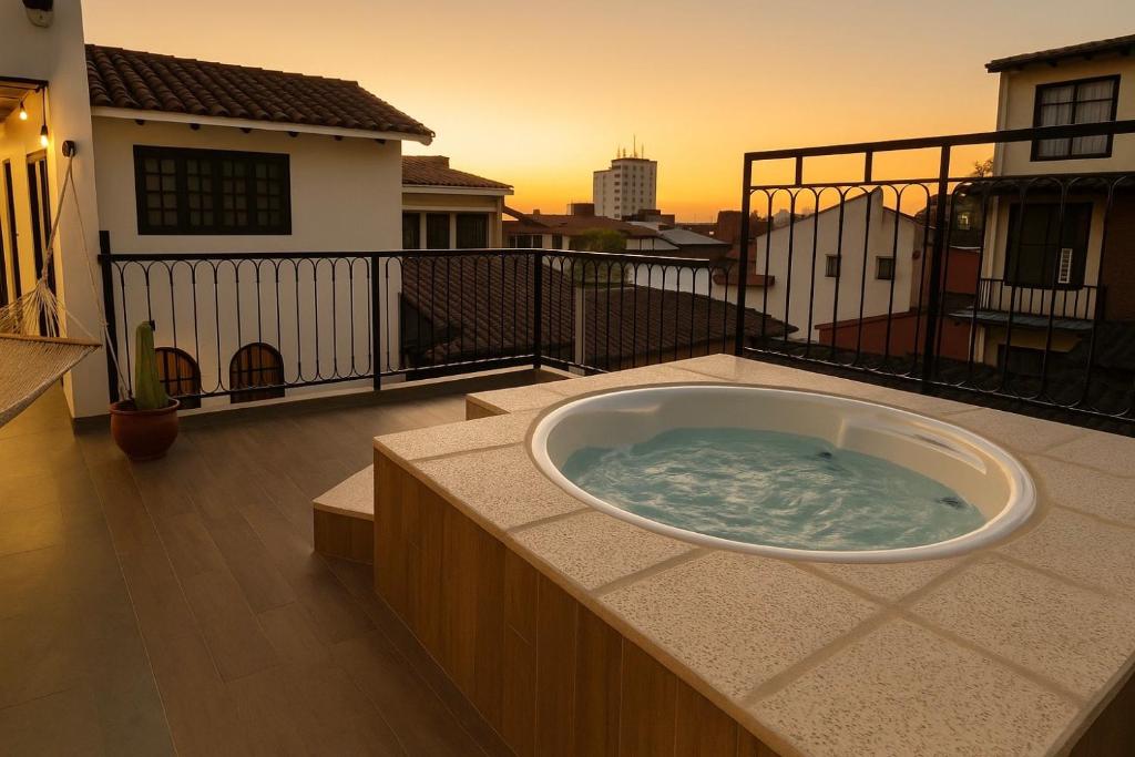 a hot tub on the balcony of a house at Sarao 2 in Santa Cruz de la Sierra