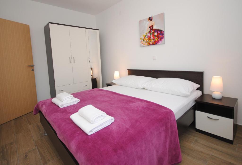 Posteľ alebo postele v izbe v ubytovaní Apartments Valeria