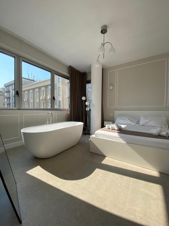 En eller flere senge i et værelse på Orchidea suites - City center