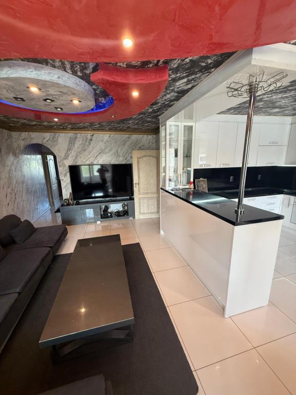 a living room with a couch and a table at LADA Apartment in Nesebar