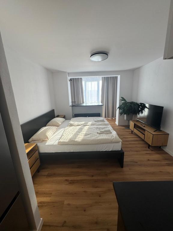 Postel nebo postele na pokoji v ubytování Modern Studio near City Center