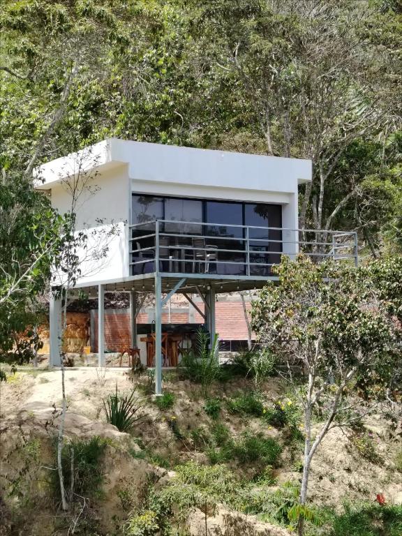 a house in the middle of a forest at Villas Entre Lagos in Lebrija