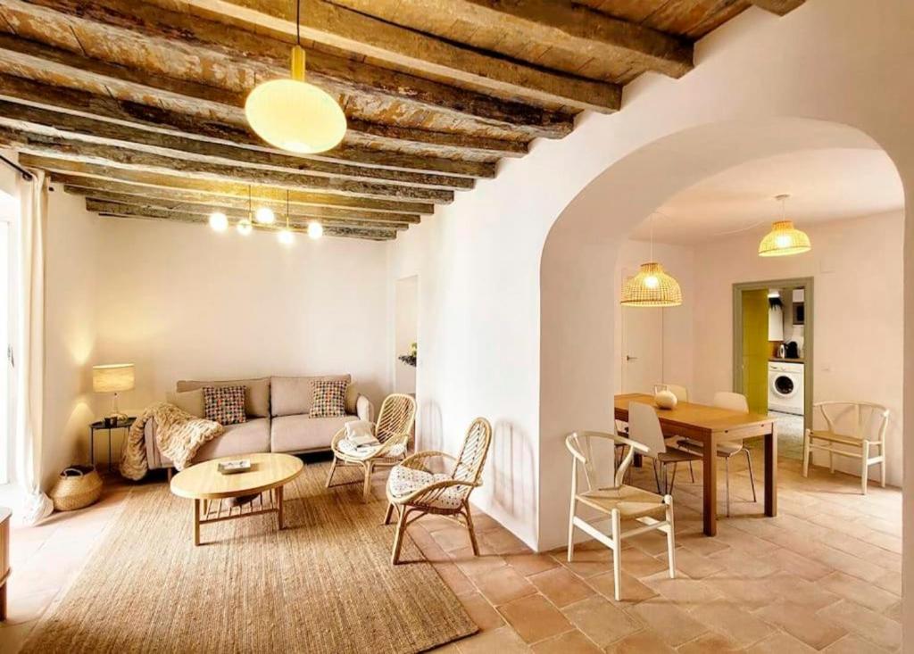 a living room with a couch and a table at 'La Fontanalla' Naturaleza a dos pasos del Mar in Alcalá de los Gazules