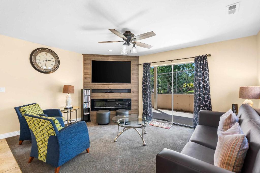 a living room with a couch and a tv at Fairway View Escape - For 8 in Branson