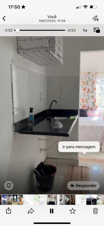 a screenshot of a picture of a kitchen and a bedroom at Santana hospedagem in Cabo Frio