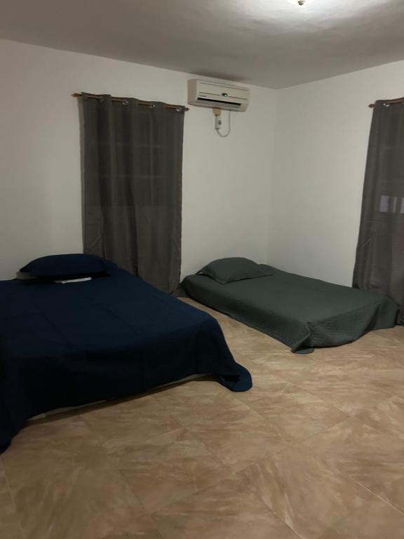 Postel nebo postele na pokoji v ubytování Villas Burnette