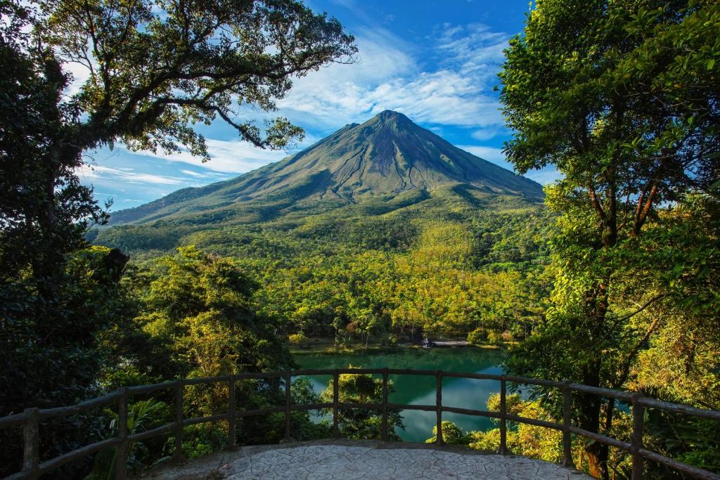 a mountain with a lake in front of it at Hotel Los Lagos Spa & Resort in Fortuna