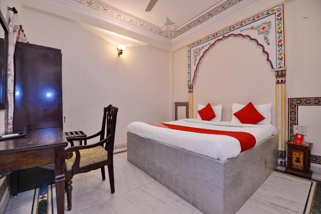 Postel nebo postele na pokoji v ubytování Hotel O Tordi Haveli