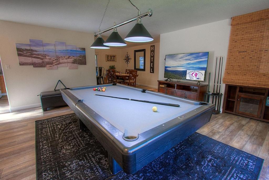 a living room with a pool table and a tv at NVH0823 - Sadies Hustle home in Zephyr Cove