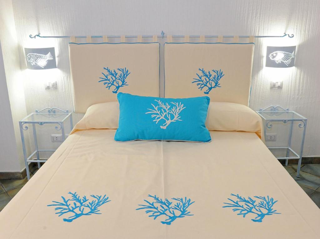 Postel nebo postele na pokoji v ubytování Alghero Sunrise