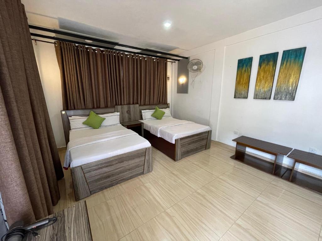 Una cama o camas en una habitación de Ella Always Welcome Resort