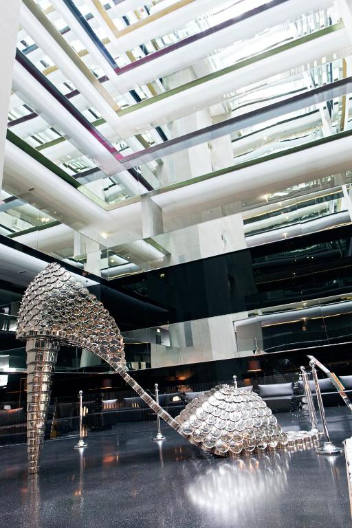 two sculptures in a room with a ceiling at Troia Design Hotel in Troia