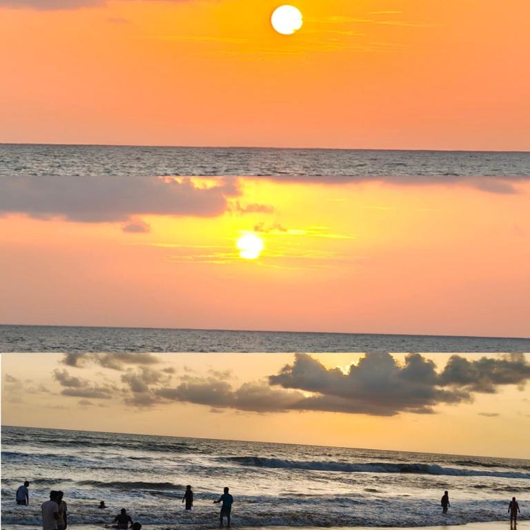 a group of people on the beach at sunset at Gokarna Govekar Sea Facing Rooms in Gokarn