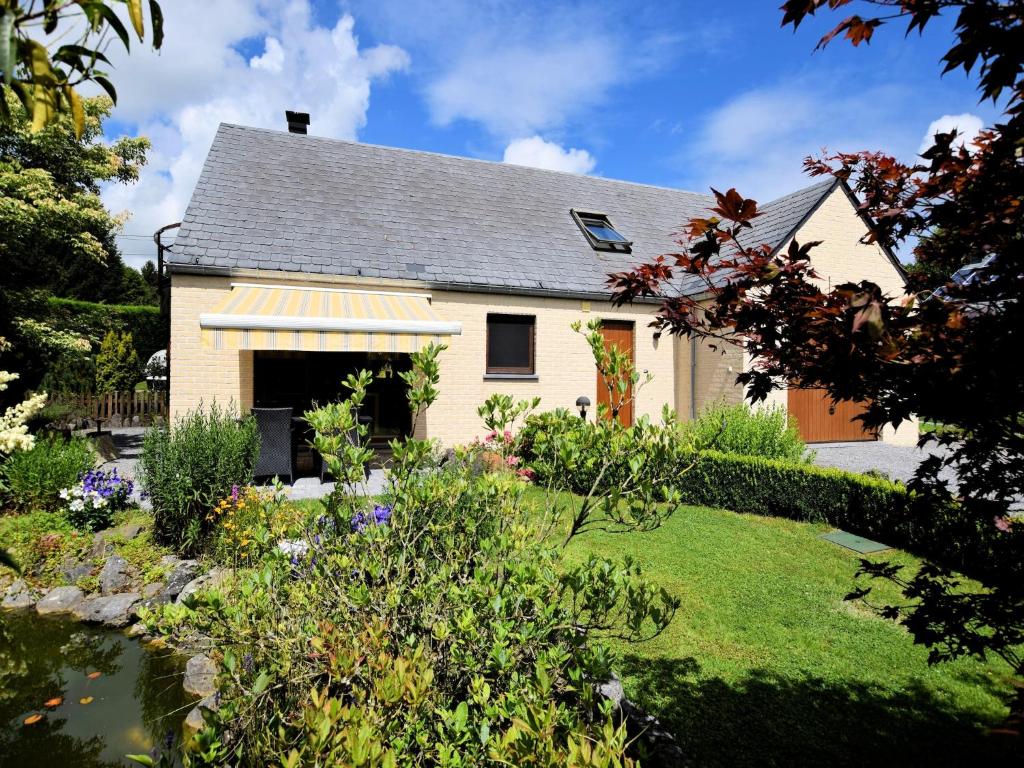 a house with a garden in front of it at Beautiful Holiday Home in Durbuy with Garden in Septon