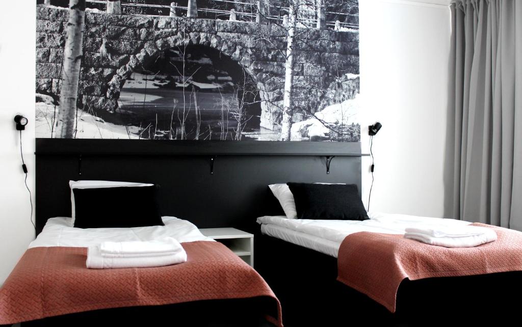Postelja oz. postelje v sobi nastanitve Forenom Aparthotel Raahe