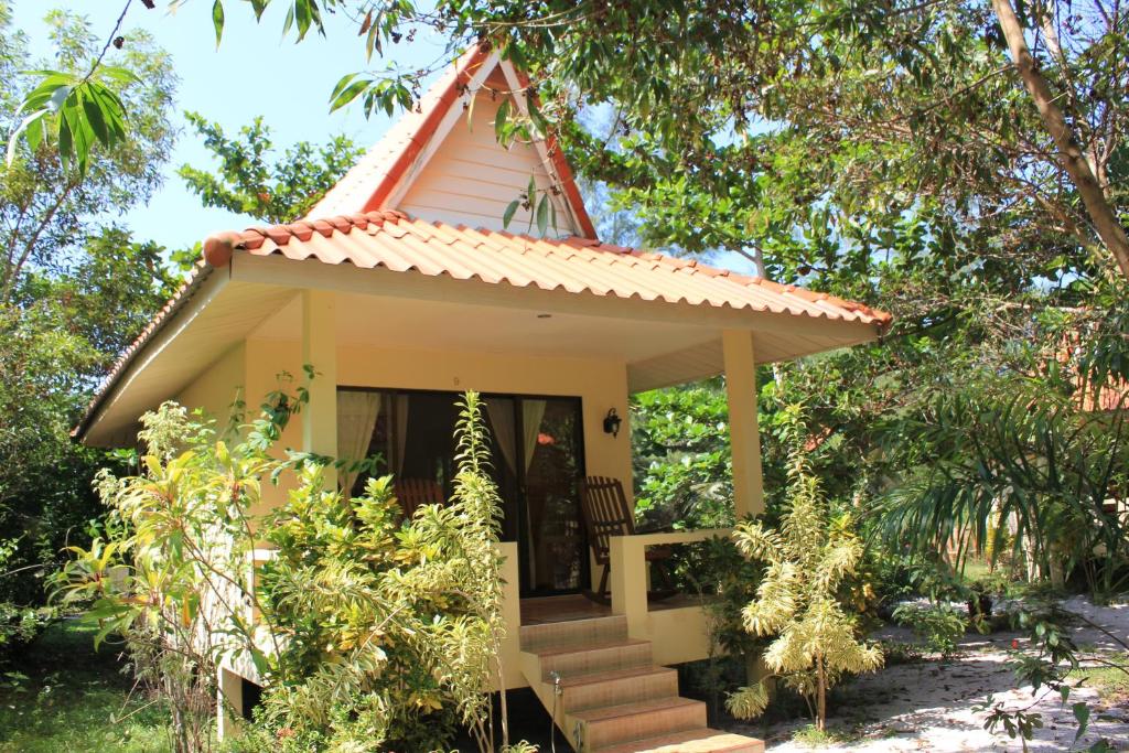 a small house with a pitched roof at Buffalo Bay Vacation Club in Ko Phayam