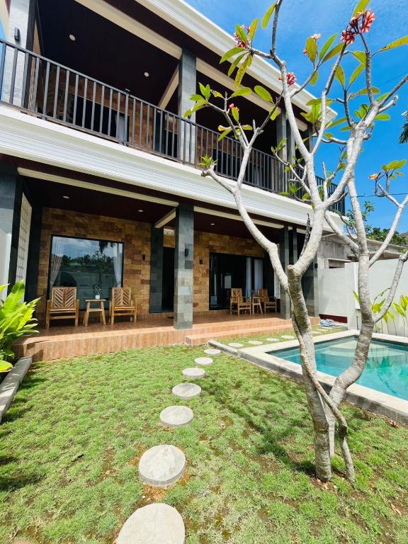 an image of a house with a swimming pool at The Res Village Lombok in Kuta Lombok