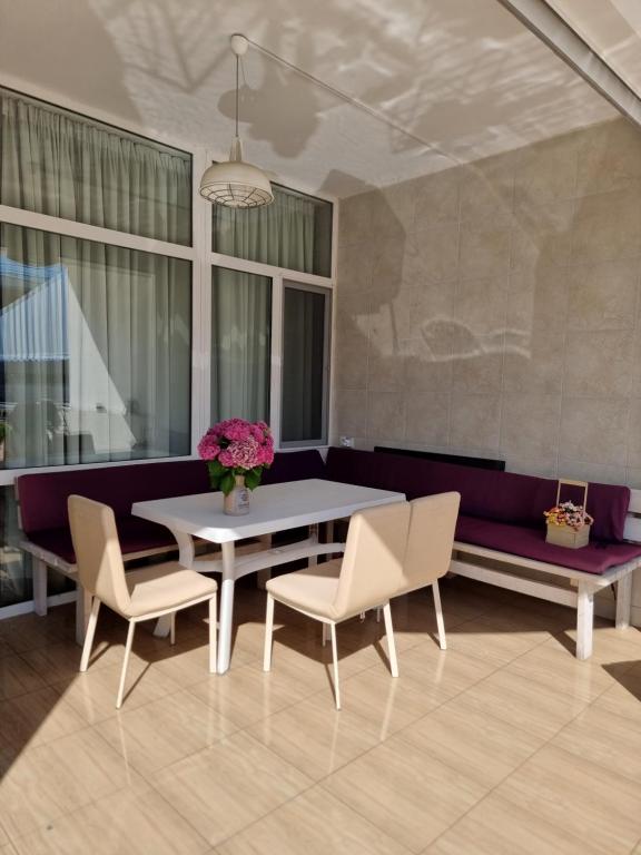 a dining room with a table and chairs at Gold Bugaz in Odesa