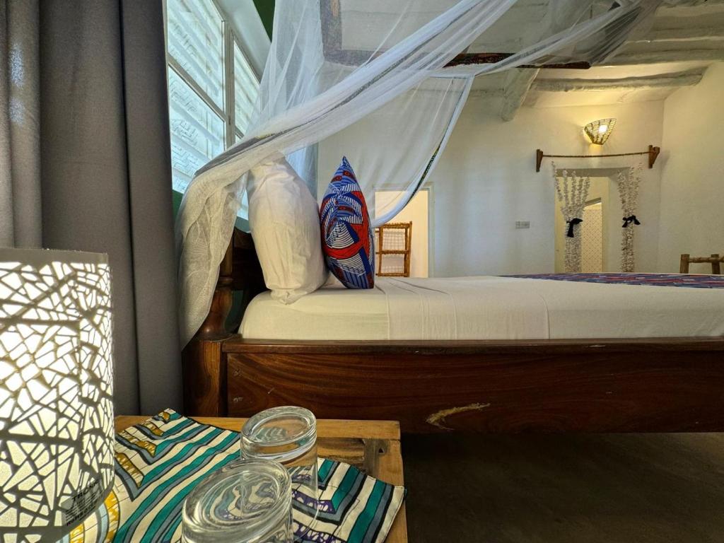 Кровать или кровати в номере Starfish Garden Lodge