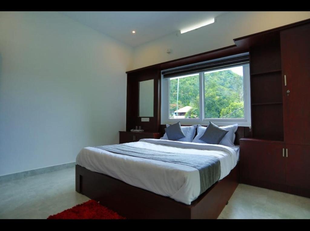 Postel nebo postele na pokoji v ubytování Cozy Nest Homestay, Thokkupara Munnar