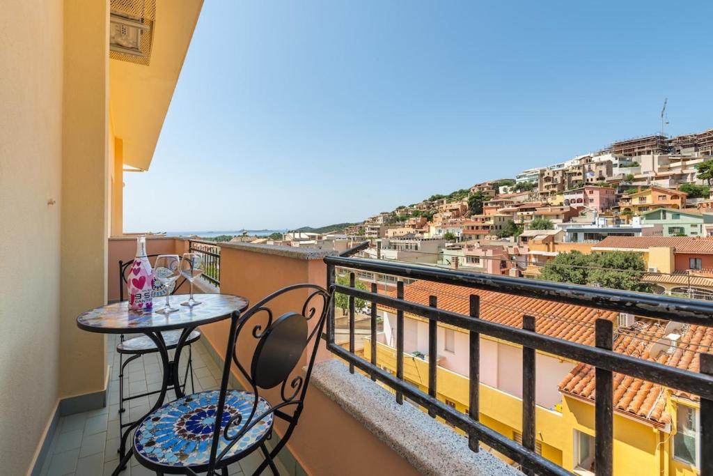 a balcony with a table and chairs and a view at Mare fuori in Villasimius