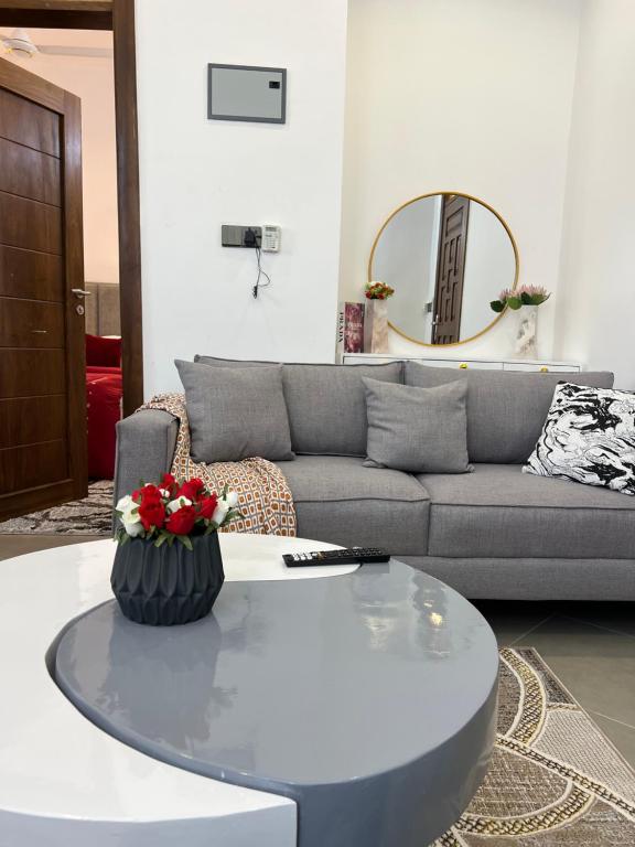 a living room with a couch and a table at DnJ cozy homes in Dar es Salaam