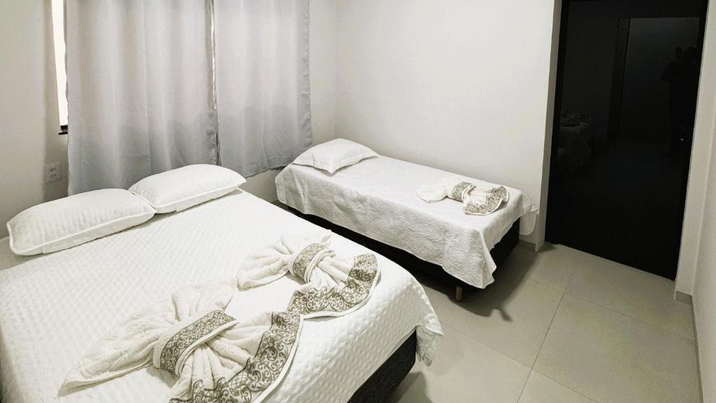 Ένα ή περισσότερα κρεβάτια σε δωμάτιο στο Sua Casa em Porto Nacional/TO. Wifi, Conforto, Localização