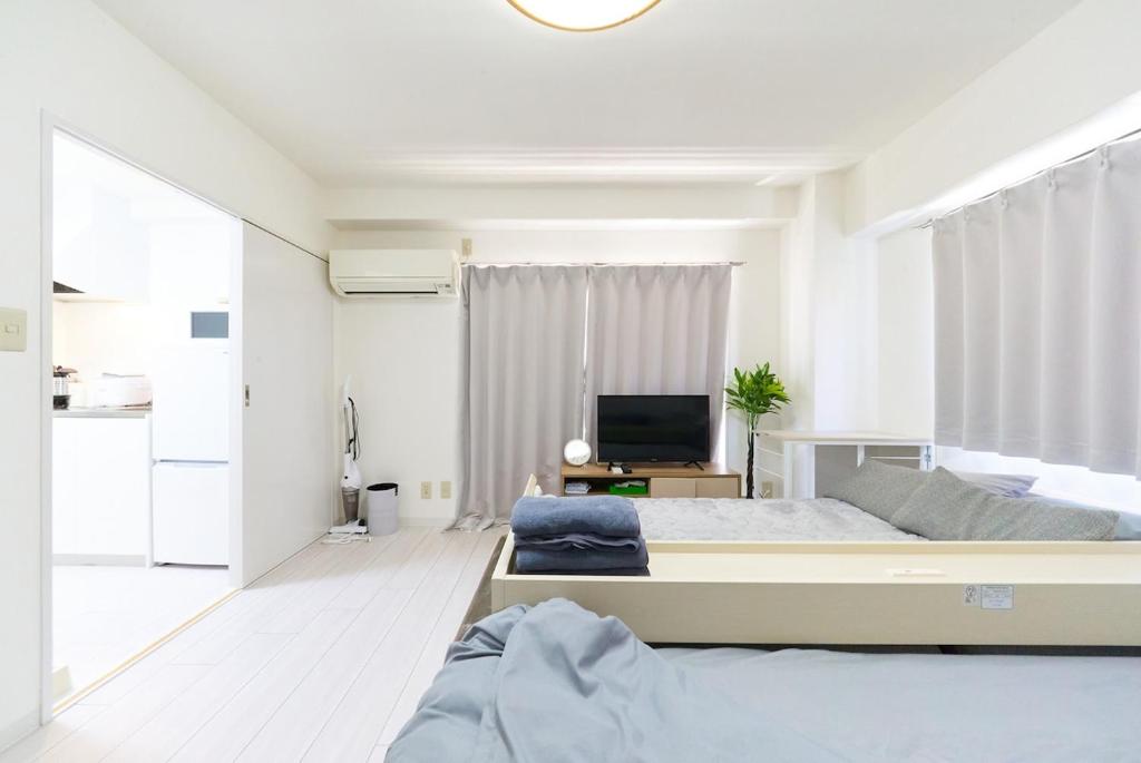 TV a/nebo společenská místnost v ubytování Maison Junes 21