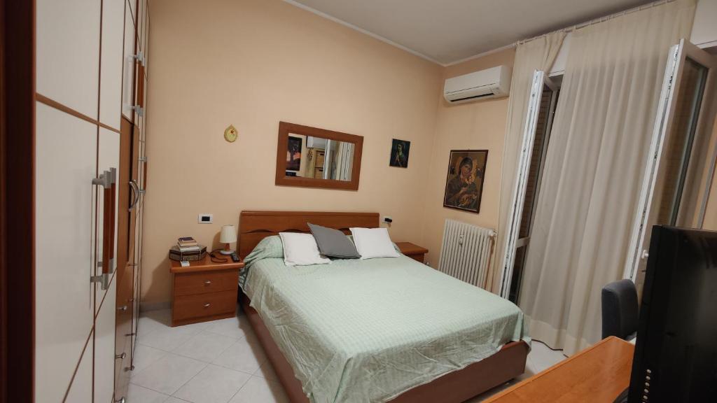 Postel nebo postele na pokoji v ubytování Tommaso Grossi Apartment