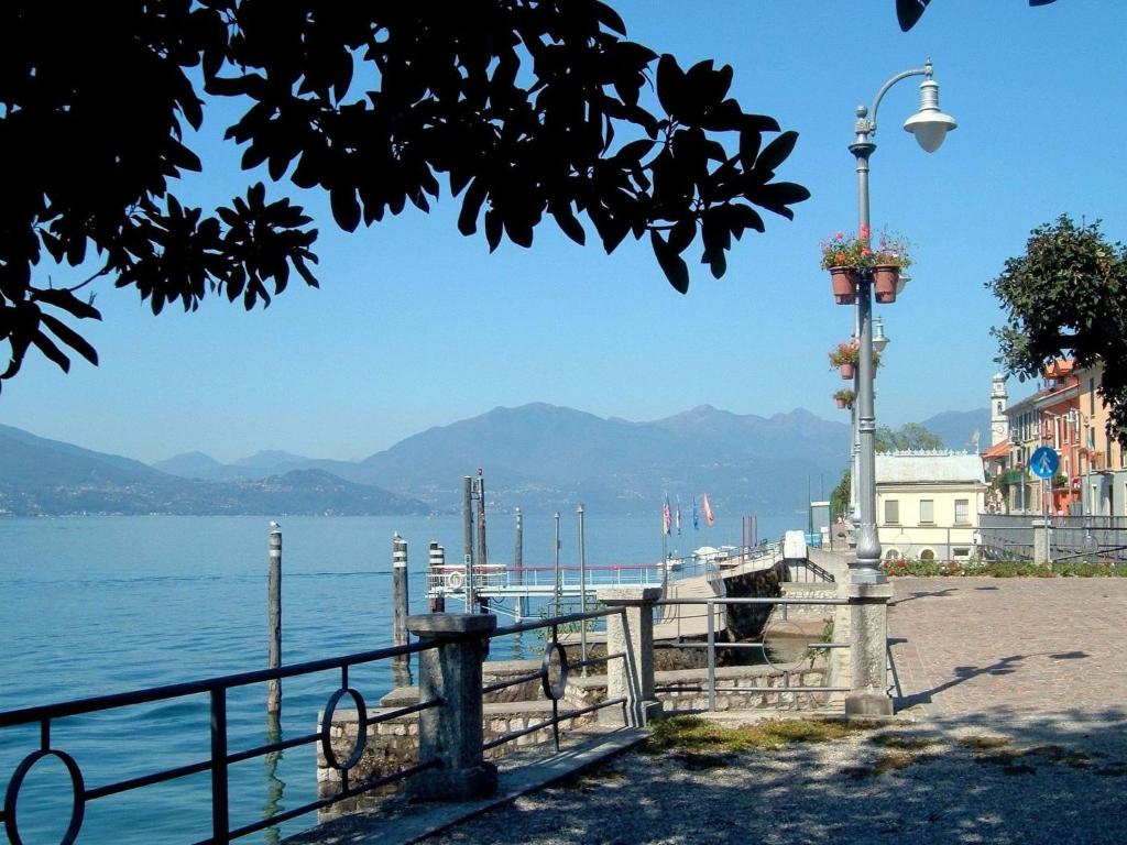 a view of a body of water with a street light at Apartment in Ghiffa with Lake Maggiore Views in Ghiffa