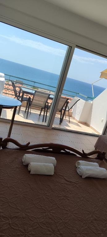 a room with a view of the ocean on a ship at Apartment Kanali The best view in Kanali