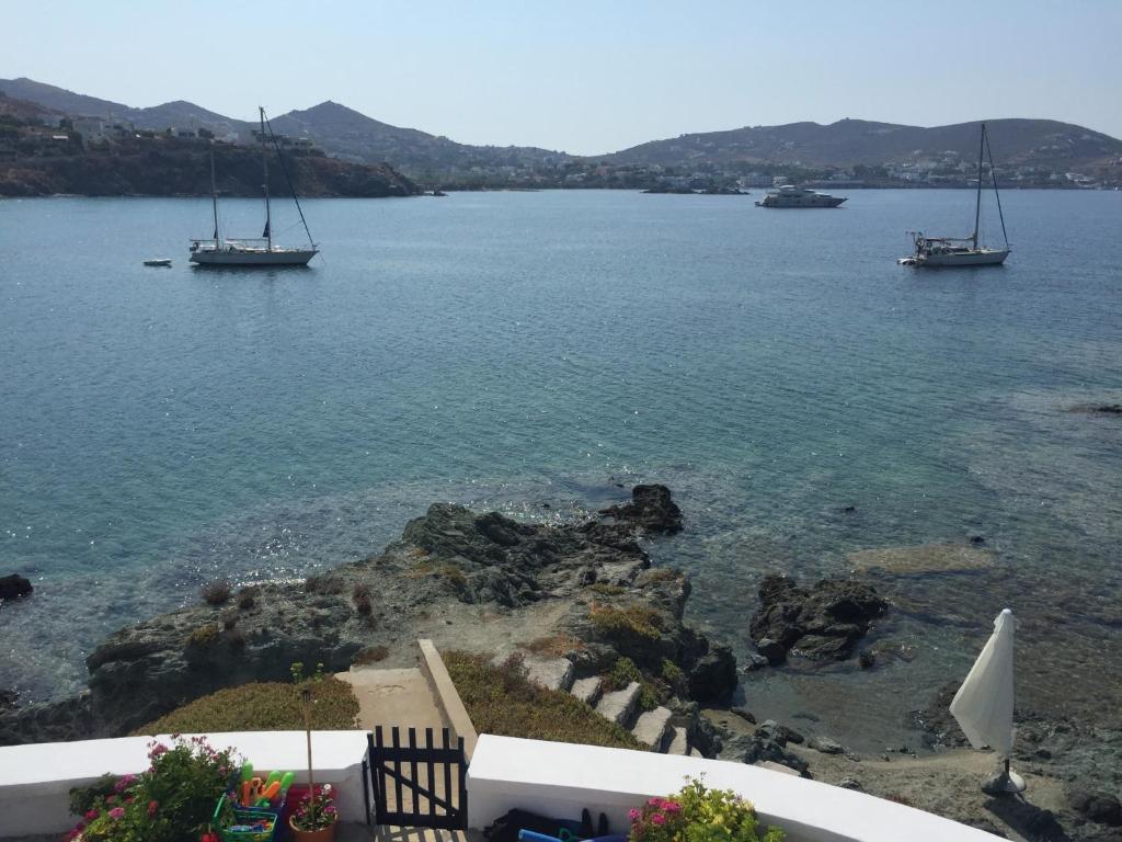 a view of a body of water with boats in it at Captain Bay's Unique Heritage Home in Finikas