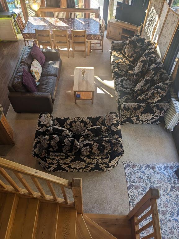 an overhead view of a living room with couches and a table at Nightingale Barn - Stunning & Huge in Etchingham
