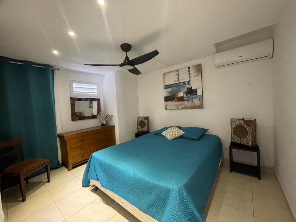 Ένα ή περισσότερα κρεβάτια σε δωμάτιο στο Le Blue Lagoon