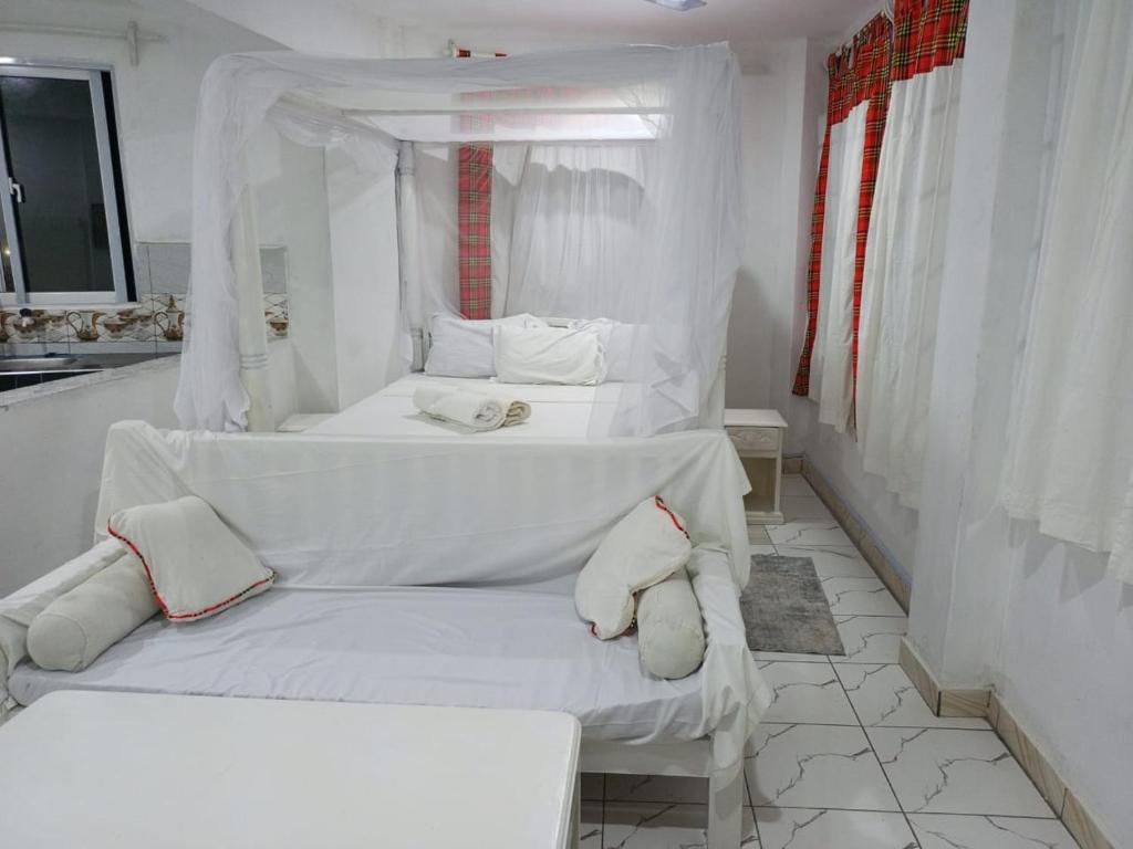 Ένα ή περισσότερα κρεβάτια σε δωμάτιο στο Tulivu Studio Apartment