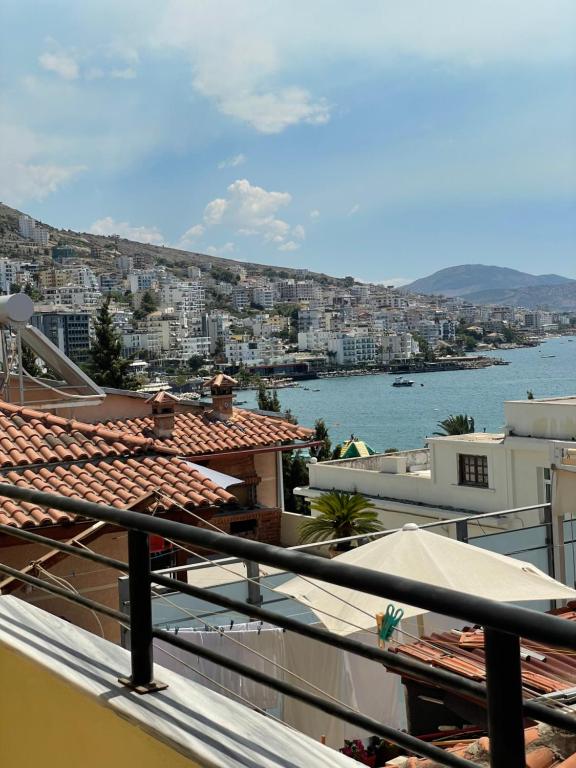 a view of a city from the balcony of a building at City Center Apartment Saranda in Sarandë