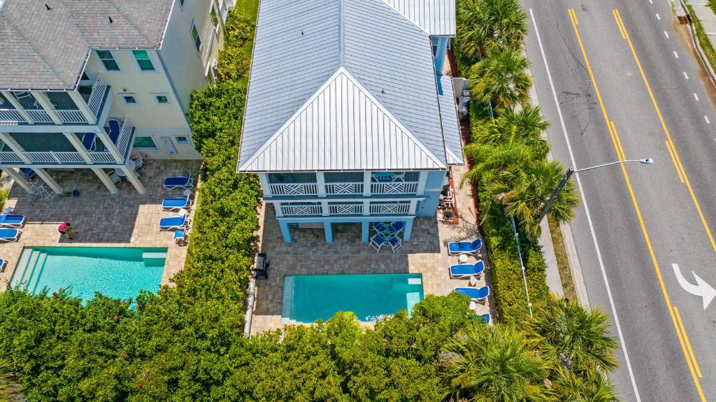 an aerial view of a house with a swimming pool at Heated Pool Elevator Game Room & Ocean Decks in Coquina Gables