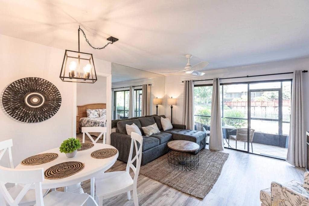 a living room with a couch and a table at Park Shore Resort-Deluxe Condo 1st FloorBLDGE 134 in Naples