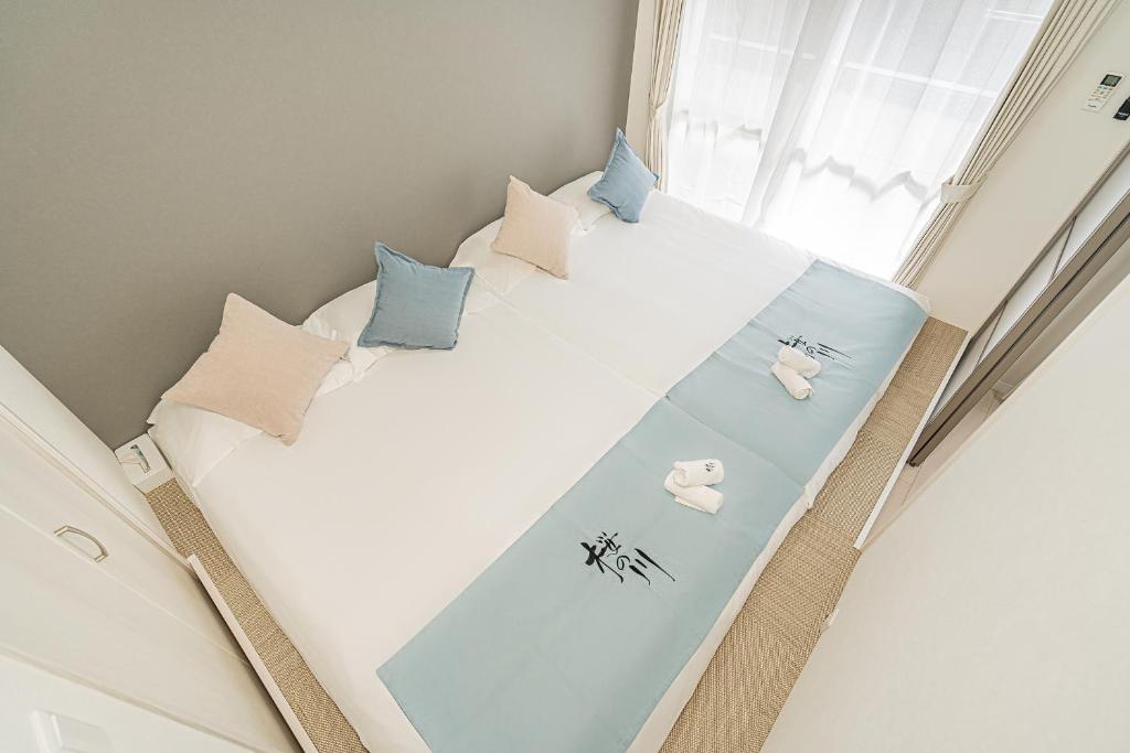 Ένα ή περισσότερα κρεβάτια σε δωμάτιο στο 桜の川70-39 駒込駅2分 2-5人丨2 minutes from Komagome Station 2-5 people