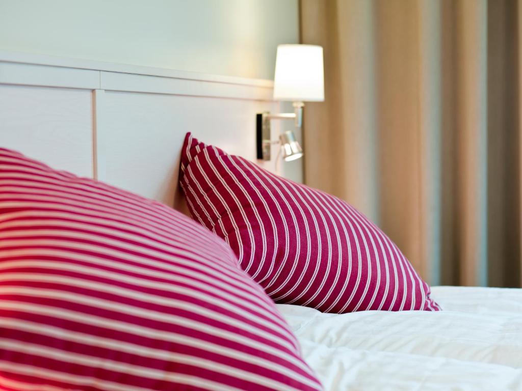 Postel nebo postele na pokoji v ubytování Ringsjöstrand Hotel