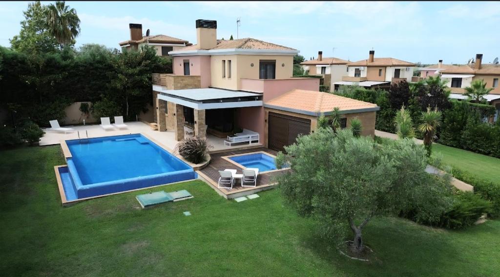 an aerial view of a house with a swimming pool at Sani Waterscape Villa in Sani Beach