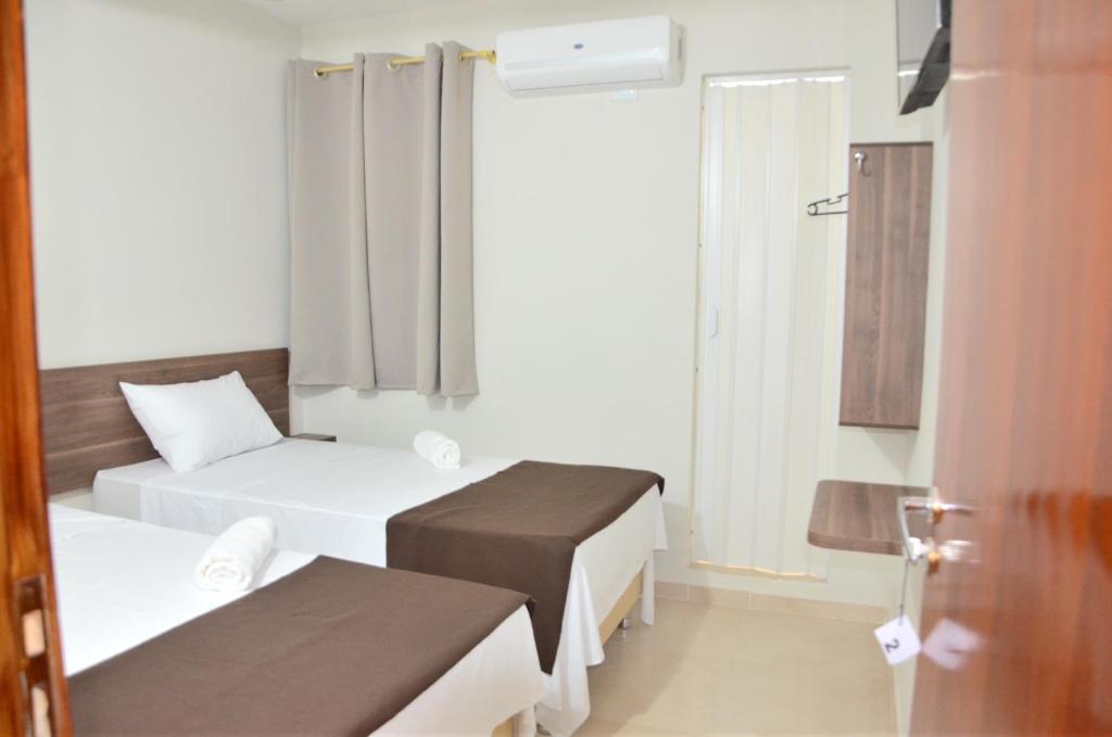 Postel nebo postele na pokoji v ubytování Hotel Sur Brasil
