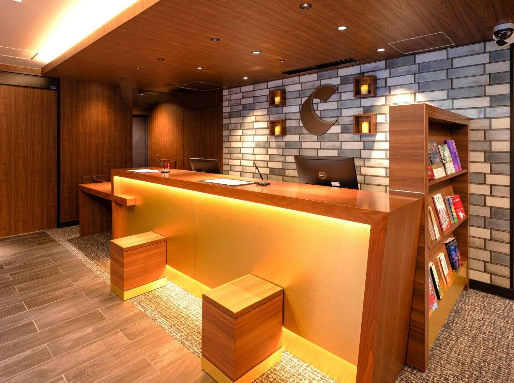 an office with a desk with a laptop on it at Comfort Inn Tokyo Roppongi in Tokyo