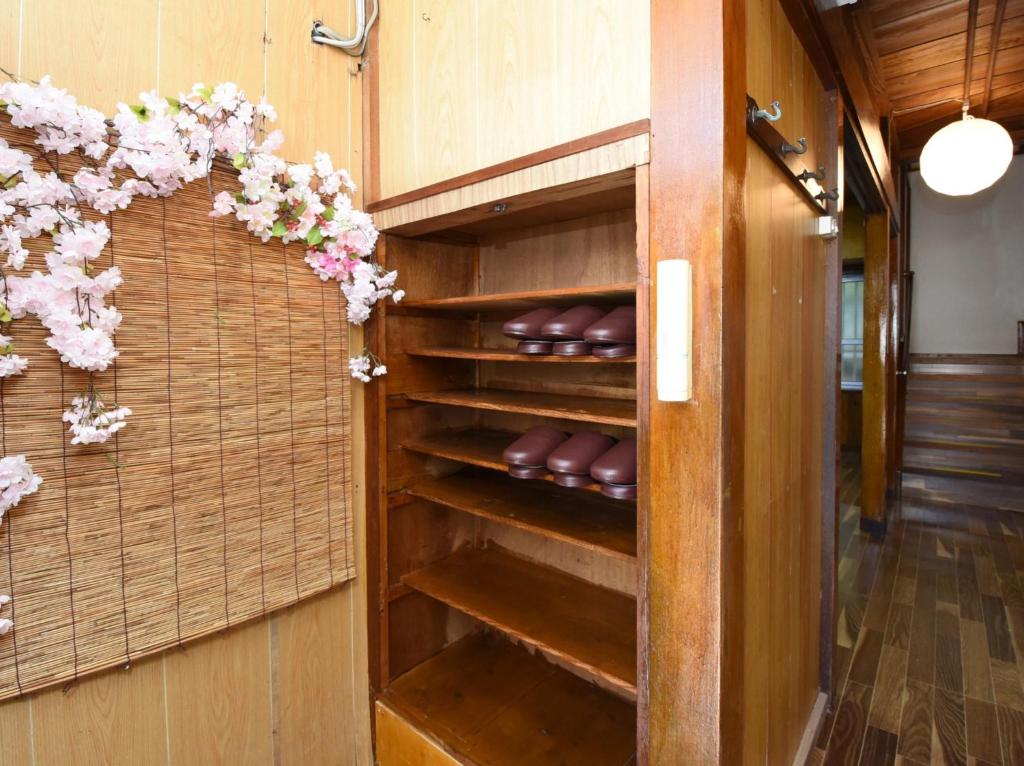 a wine cellar with brown leathers in a wooden cabinet at Villa Ukishima - Vacation STAY 07308v in Naha