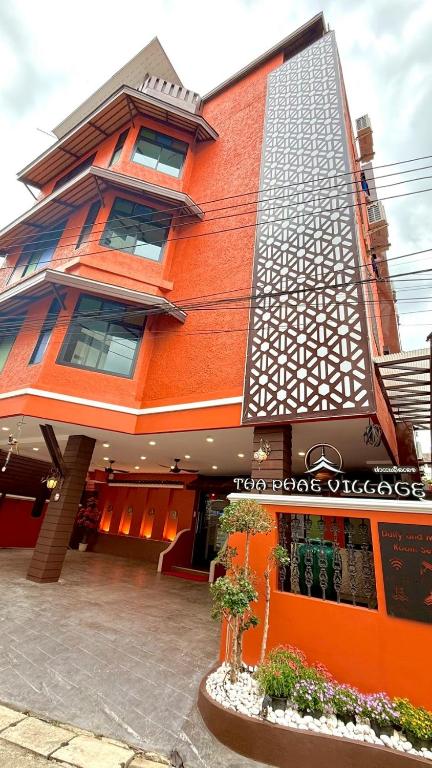 a building with an orange at Tha Phae Village in Chiang Mai